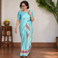 Blue Assam Handloom Silk Cotton Mekhela Chador with Blouse Piece, draped and worn by a woman, AI visual of the saree, iTokri