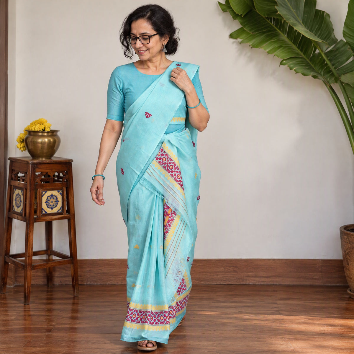 Blue Assam Handloom Silk Cotton Mekhela Chador with Blouse Piece, draped and worn by a woman, AI visual of the saree, iTokri