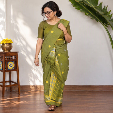 Green Assam Handloom Silk Cotton Mekhela Chador with Blouse Piece, draped and worn by a woman, AI visual of the saree, iTokri
