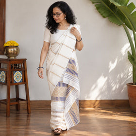 White Assam Handloom Silk Cotton Mekhela Chador with Blouse Piece, draped and worn by a woman, AI visual of the saree, iTokri