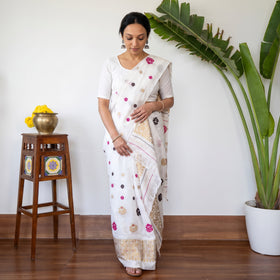 White Assam Handloom Silk Cotton Mekhela Chador with Blouse Piece, draped and worn by a woman, AI visual of the saree, iTokri