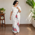 White Assam Handloom Silk Cotton Mekhela Chador with Blouse Piece, draped and worn by a woman, AI visual of the saree, iTokri
