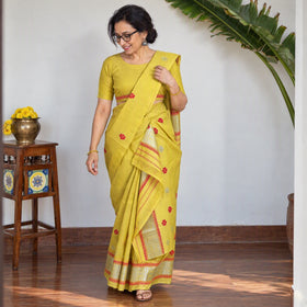Yellow Assam Handloom Silk Cotton Mekhela Chador with Blouse Piece, draped and worn by a woman, AI visual of the saree, iTokri