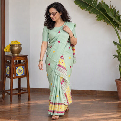 Green Assam Handloom Silk Cotton Mekhela Chador with Blouse Piece, draped and worn by a woman, AI visual of the saree, iTokri