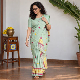 Green Assam Handloom Silk Cotton Mekhela Chador with Blouse Piece, draped and worn by a woman, AI visual of the saree, iTokri
