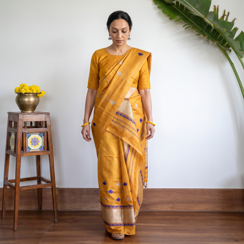 Yellow Assam Handloom Silk Cotton Mekhela Chador with Blouse Piece, draped and worn by a woman, AI visual of the saree, iTokri