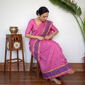 Pink Assam Handloom Silk Cotton Mekhela Chador with Blouse Piece, draped and worn by a woman, AI visual of the saree, iTokri