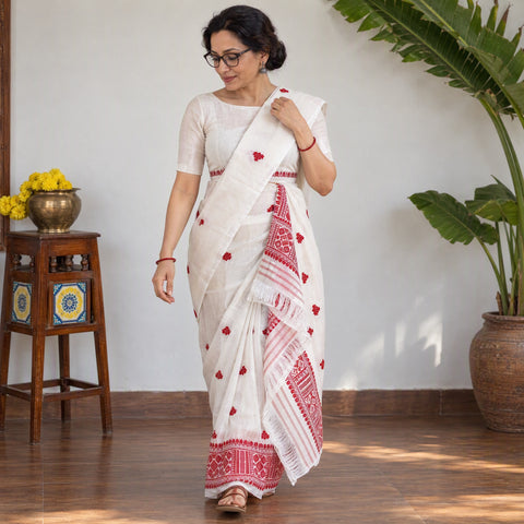 White Assam Handloom Silk Cotton Mekhela Chador with Blouse Piece, draped and worn by a woman, AI visual of the saree, iTokri