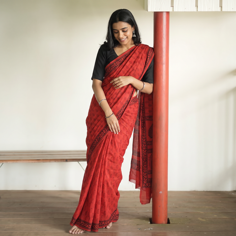 Red Bagh Hand Block Print Natural Dyed Cotton Saree, draped and worn by a woman, AI visual of the saree, iTokri