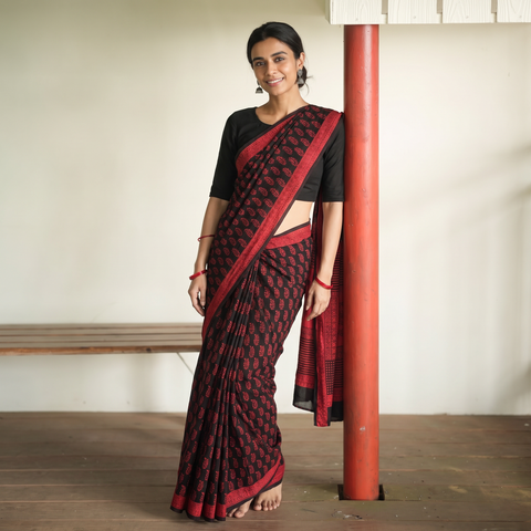 Red Bagh Hand Block Print Natural Dyed Cotton Saree, draped and worn by a woman, AI visual of the saree, iTokri