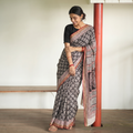 Black Bagh Hand Block Print Natural Dyed Cotton Saree, draped and worn by a woman, AI visual of the saree, iTokri