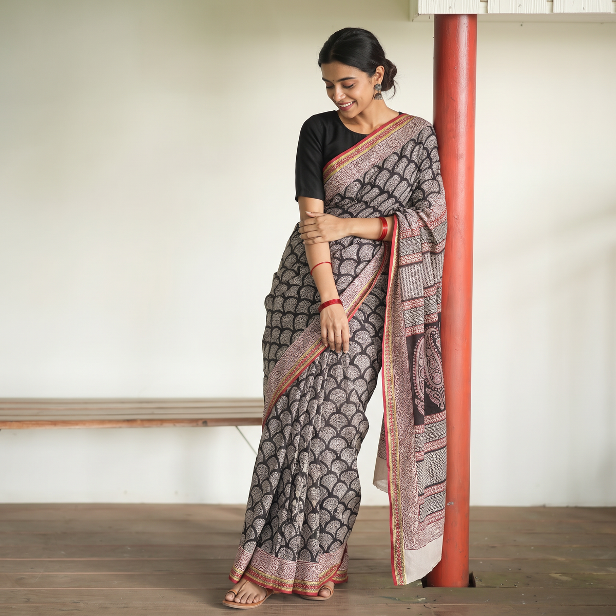 Black Bagh Hand Block Print Natural Dyed Cotton Saree, draped and worn by a woman, AI visual of the saree, iTokri