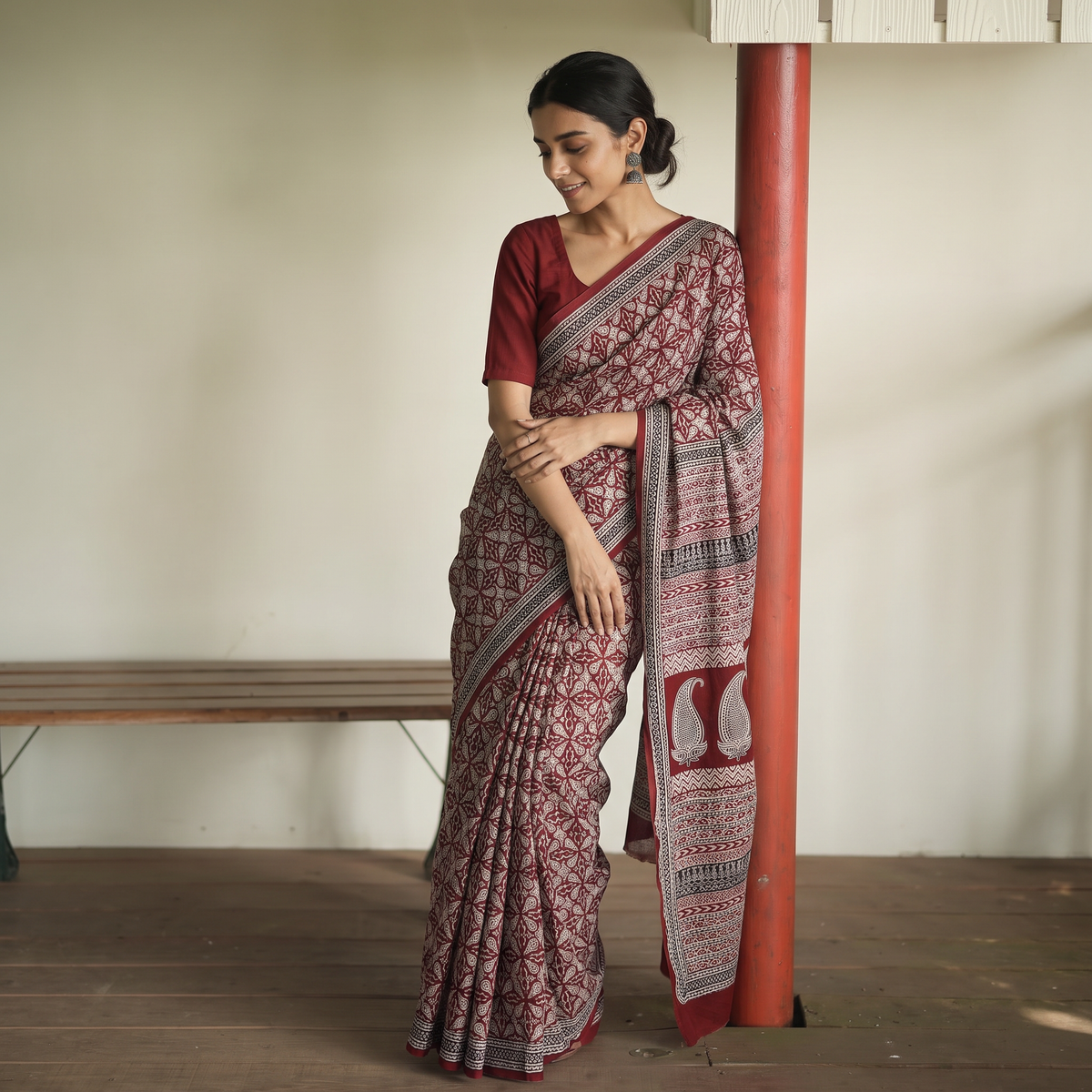 Red Bagh Hand Block Print Natural Dyed Cotton Saree, draped and worn by a woman, AI visual of the saree, iTokri
