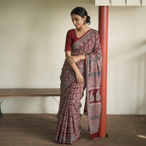 Red Bagh Hand Block Print Natural Dyed Cotton Saree, draped and worn by a woman, AI visual of the saree, iTokri