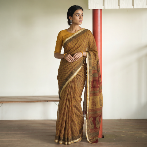 Brown Bagh Hand Block Print Natural Dyed Kota Doria Cotton Saree, draped and worn by a woman, AI visual of the saree, iTokri