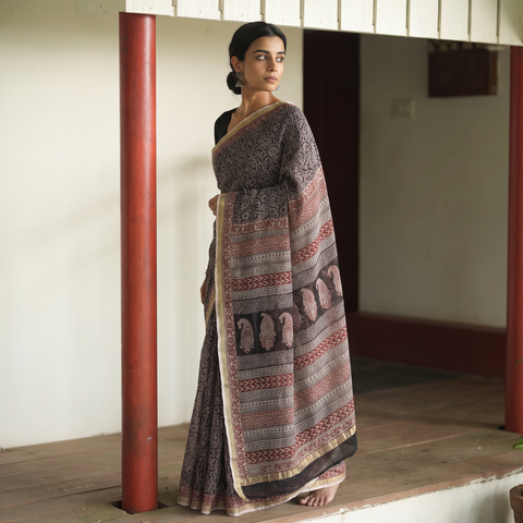 Black Bagh Hand Block Print Natural Dyed Kota Doria Cotton Saree, draped and worn by a woman, AI visual of the saree, iTokri