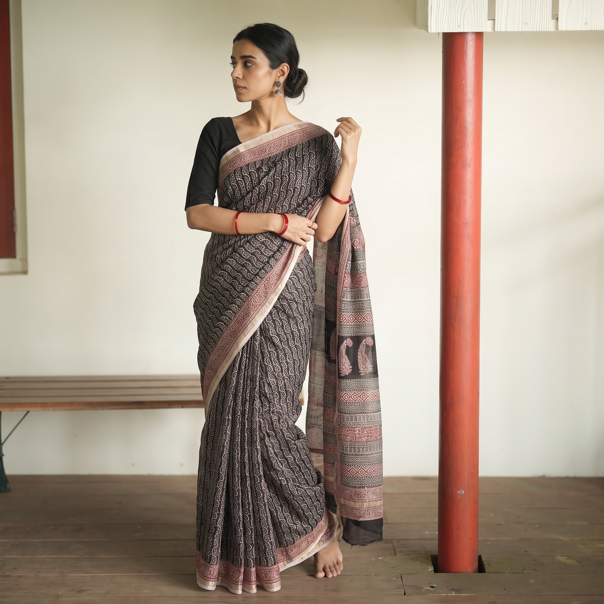 Black Bagh Hand Block Print Natural Dyed Kota Doria Cotton Saree, draped and worn by a woman, AI visual of the saree, iTokri