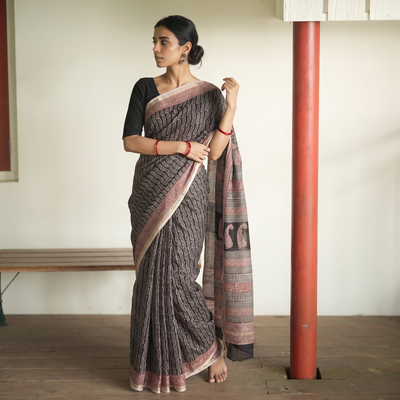 Black Bagh Hand Block Print Natural Dyed Kota Doria Cotton Saree, draped and worn by a woman, AI visual of the saree, iTokri