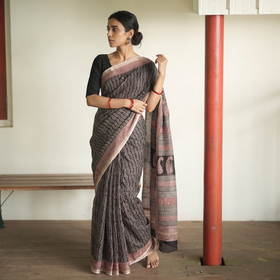 Black Bagh Hand Block Print Natural Dyed Kota Doria Cotton Saree, draped and worn by a woman, AI visual of the saree, iTokri