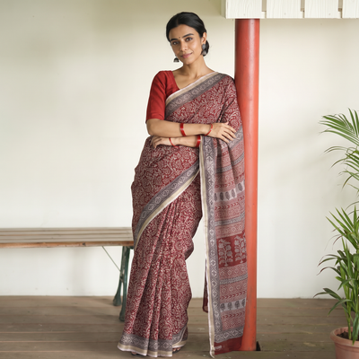 Maroon Bagh Hand Block Print Natural Dyed Kota Doria Cotton Saree, draped and worn by a woman, AI visual of the saree, iTokri