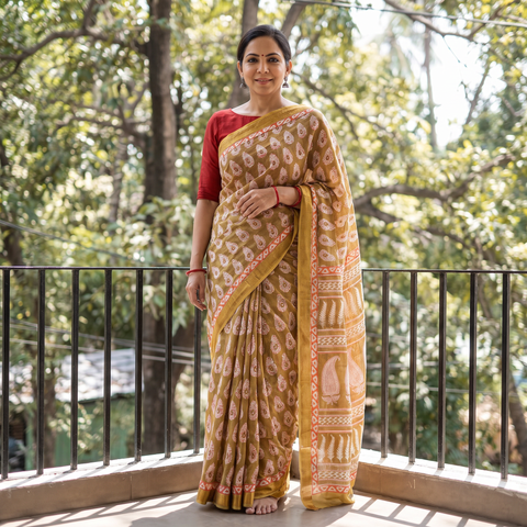 Brown Bagh Hand Block Print Natural Dyed Maheshwari Silk Zari Border Saree, draped and worn by a woman, AI visual of the saree, iTokri