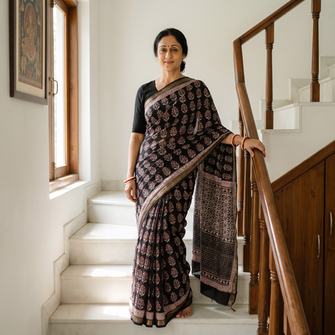 Black Bagh Hand Block Print Natural Dyed Maheshwari Silk Zari Border Saree, draped and worn by a woman, AI visual of the saree, iTokri