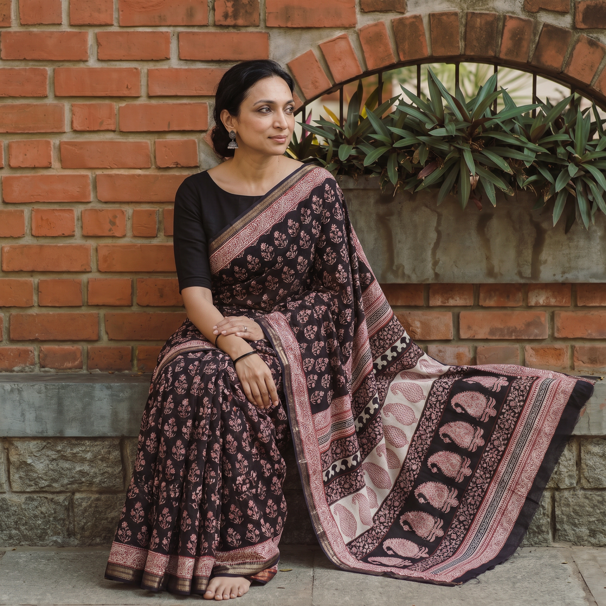 Black Bagh Hand Block Print Natural Dyed Maheshwari Silk Zari Border Saree, draped and worn by a woman, AI visual of the saree, iTokri