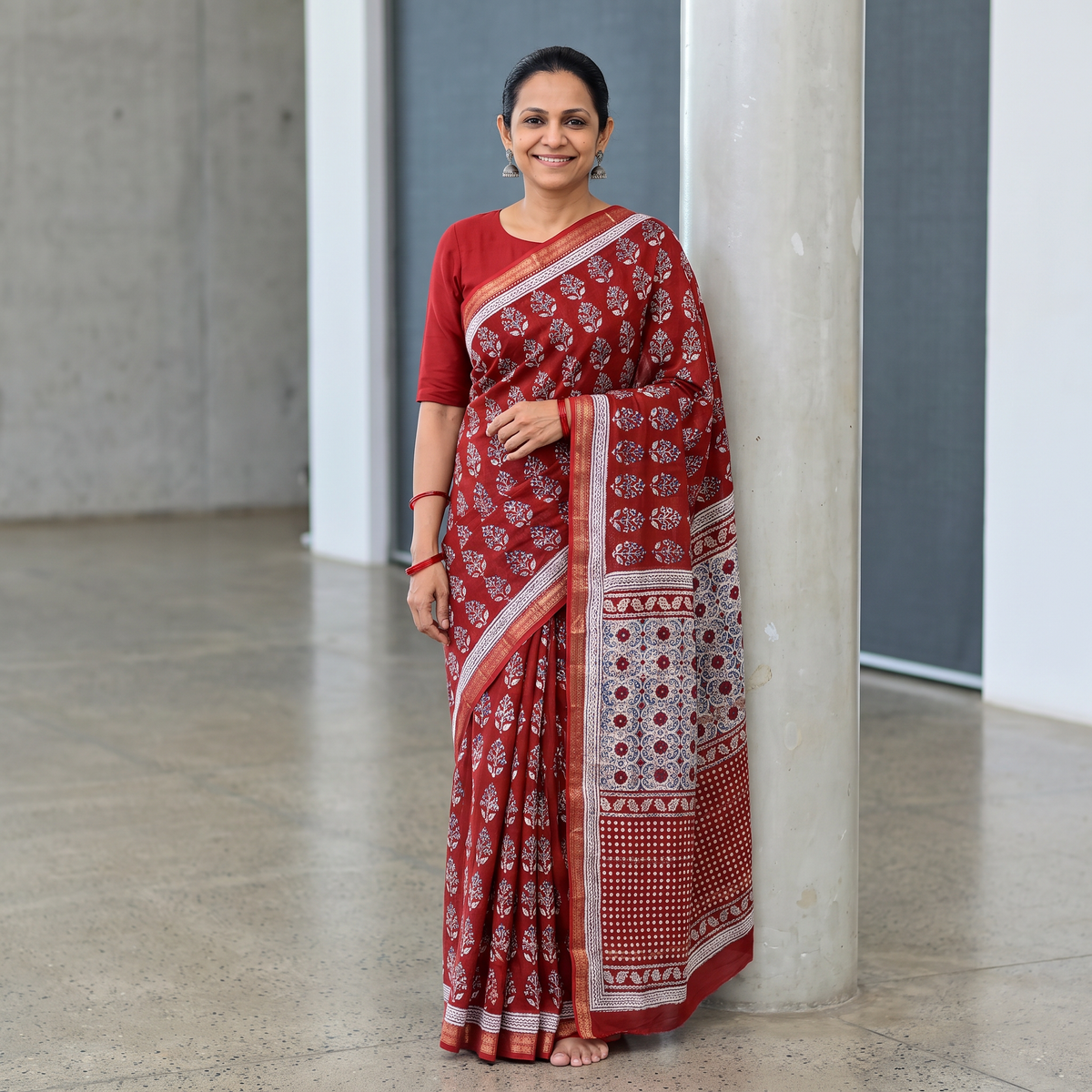 Red Bagh Hand Block Print Natural Dyed Maheshwari Silk Zari Border Saree, draped and worn by a woman, AI visual of the saree, iTokri
