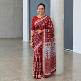 Red Bagh Hand Block Print Natural Dyed Maheshwari Silk Zari Border Saree, draped and worn by a woman, AI visual of the saree, iTokri