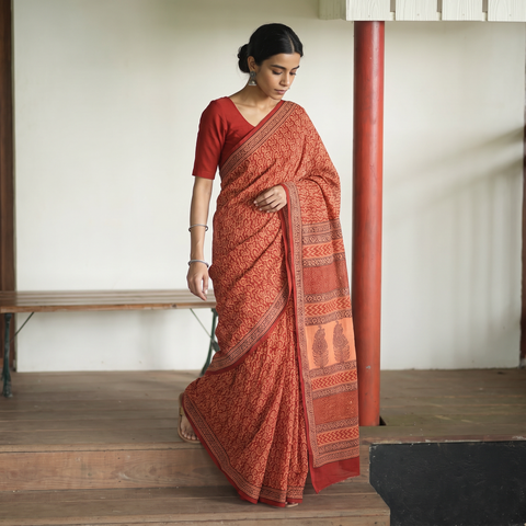Red Bagh Hand Block Printed Natural Dyed Cotton Saree, draped and worn by a woman, AI visual of the saree, iTokri