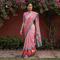 Pink Bagh Indigo Hand Block Print Natural Dyed Dola Silk Zari Work Saree, worn by a woman walking in a garden courtyard, AI visual of the saree, iTokri