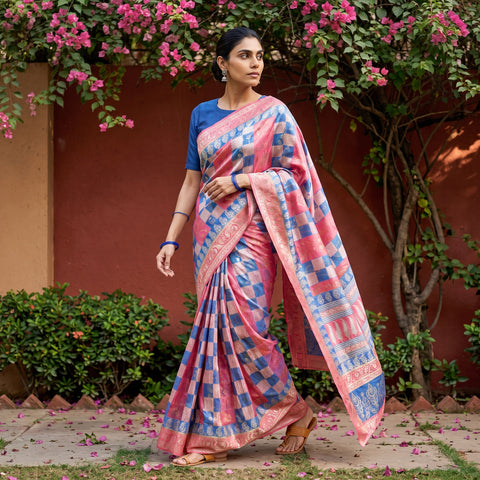 Multicolor Bagh Indigo Hand Block Print Natural Dyed Dola Silk Zari Work Saree, worn by a woman walking in a garden courtyard, AI visual of the saree, iTokri