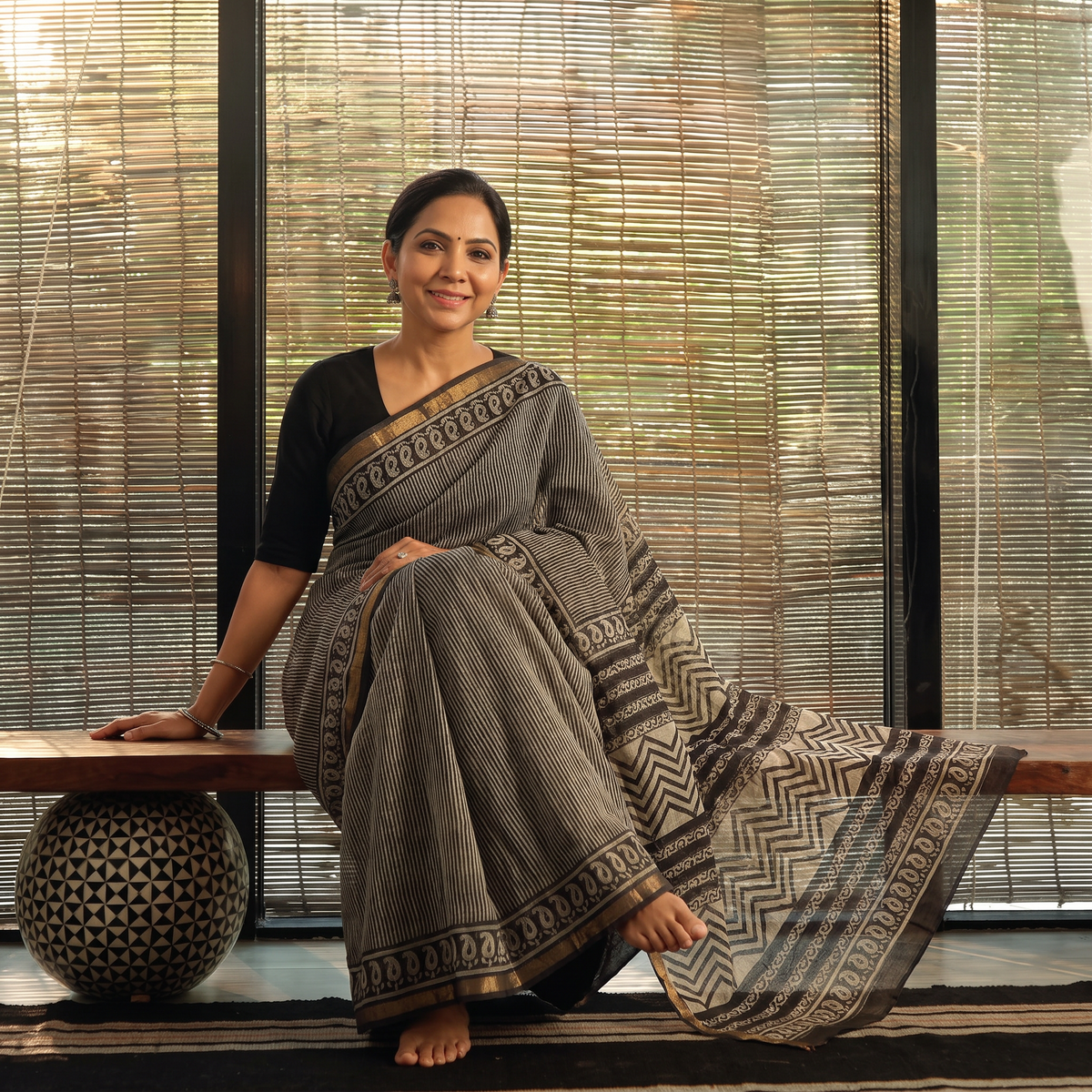 Black Bagru Hand Block Print Kota Doria Cotton Saree, draped and worn by a woman, AI visual of the saree, iTokri