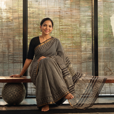 Black Bagru Hand Block Print Kota Doria Cotton Saree, draped and worn by a woman, AI visual of the saree, iTokri