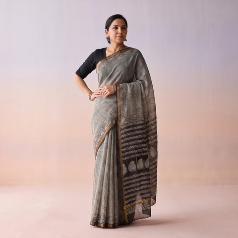 Black Bagru Hand Block Print Kota Doria Cotton Saree, draped and worn by a woman, AI visual of the saree, iTokri