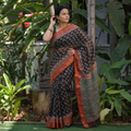 Black Bagru Hand Block Print Kota Doria Cotton Saree, draped and worn by a woman, AI visual of the saree, iTokri