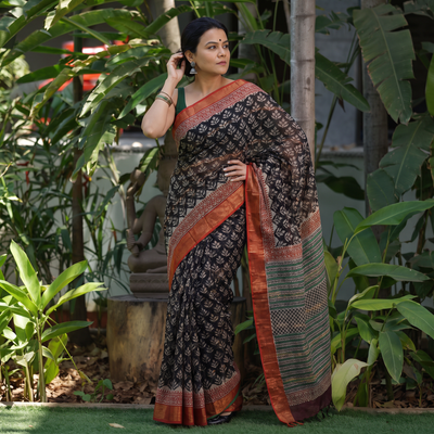 Black Bagru Hand Block Print Kota Doria Cotton Saree, draped and worn by a woman, AI visual of the saree, iTokri