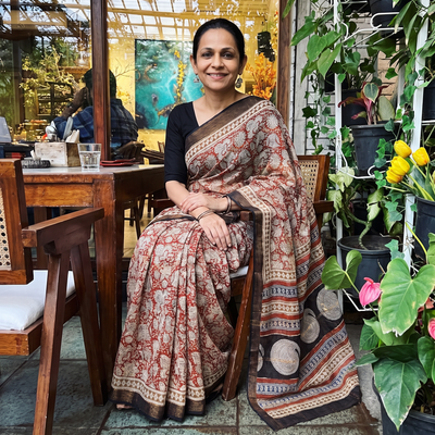 Red Bagru Hand Block Print Kota Doria Cotton Saree, draped and worn by a woman, AI visual of the saree, iTokri
