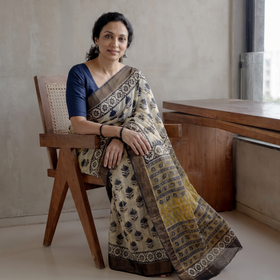 Beige Bagru Hand Block Print Kota Doria Cotton Saree, draped and worn by a woman, AI visual of the saree, iTokri