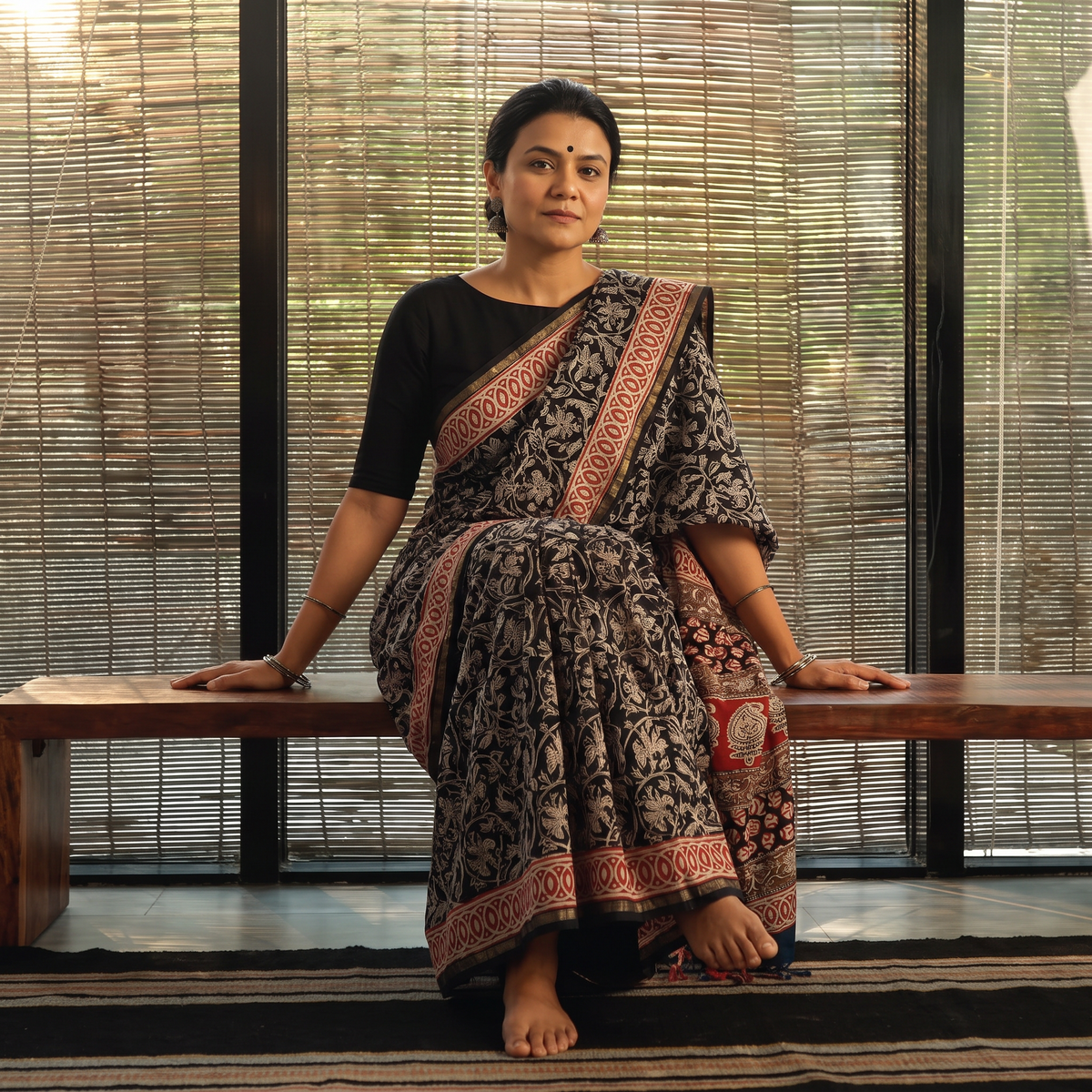Black Bagru Hand Block Print Natural Dyed Chanderi Silk Saree, draped and worn by a woman, AI visual of the saree, iTokri