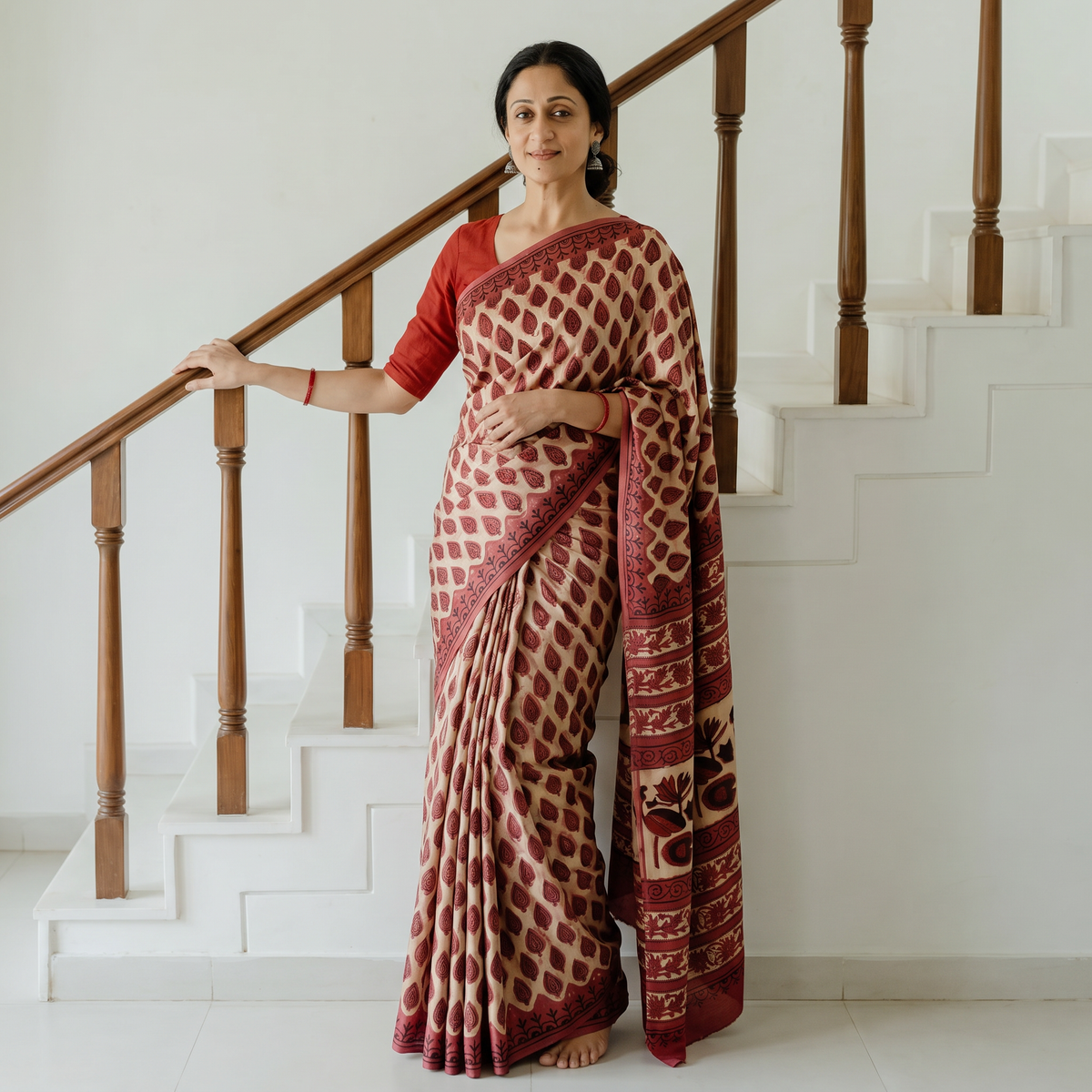 Red Bagru Hand Block Print Natural Dyed Modal Silk Saree, draped and worn by a woman, AI visual of the saree, iTokri