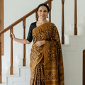 Yellow Bagru Hand Block Print Natural Dyed Modal Silk Saree, draped and worn by a woman, AI visual of the saree, iTokri