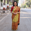 Yellow Bagru Hand Block Print Natural Dyed Modal Silk Saree, draped and worn by a woman, AI visual of the saree, iTokri