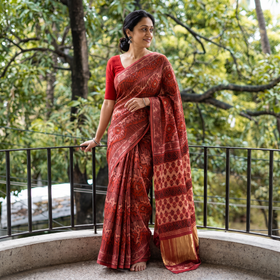Red Bagru Hand Block Print Natural Dyed Modal Silk Saree, draped and worn by a woman, AI visual of the saree, iTokri