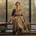 Brown Bagru Hand Block Print Natural Dyed Modal Silk Saree, draped and worn by a woman, AI visual of the saree, iTokri