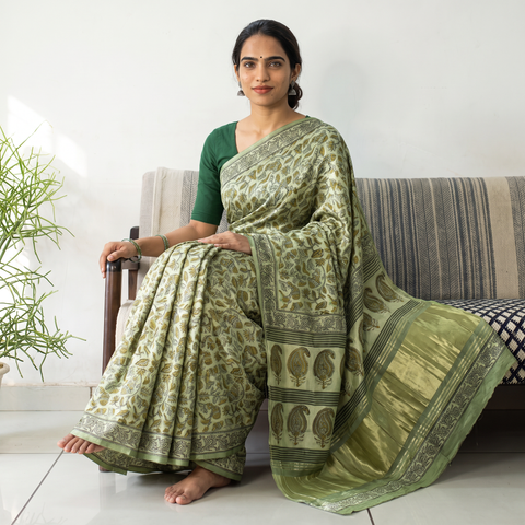 Green Bagru Hand Block Print Natural Dyed Modal Silk Saree, draped and worn by a woman, AI visual of the saree, iTokri