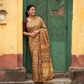 Yellow Bagru Hand Block Print Natural Dyed Modal Silk Saree, draped and worn by a woman, AI visual of the saree, iTokri