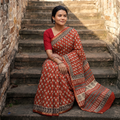 Red Bagru Hand Block Print Natural Dyed Mulberry Silk Saree, draped and worn by a woman, AI visual of the saree, iTokri