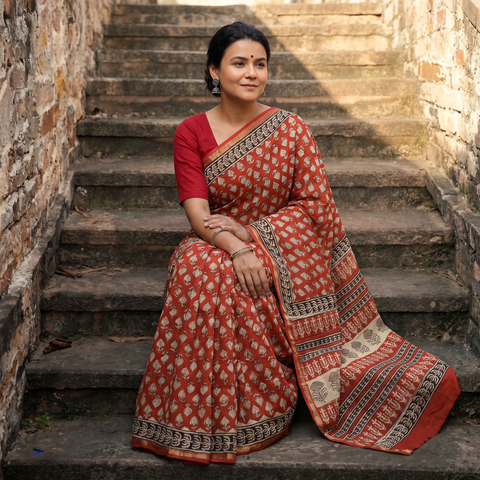Red Bagru Hand Block Print Natural Dyed Mulberry Silk Saree, draped and worn by a woman, AI visual of the saree, iTokri