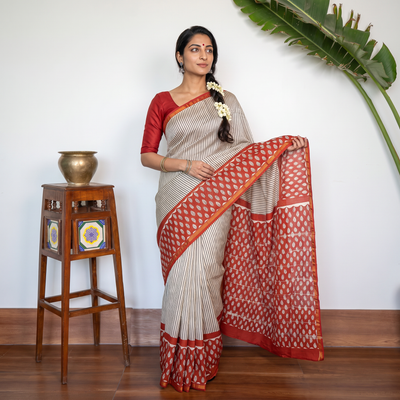 Red Bagru Hand Block Print Natural Dyed Mulberry Silk Saree, draped and worn by a woman, AI visual of the saree, iTokri